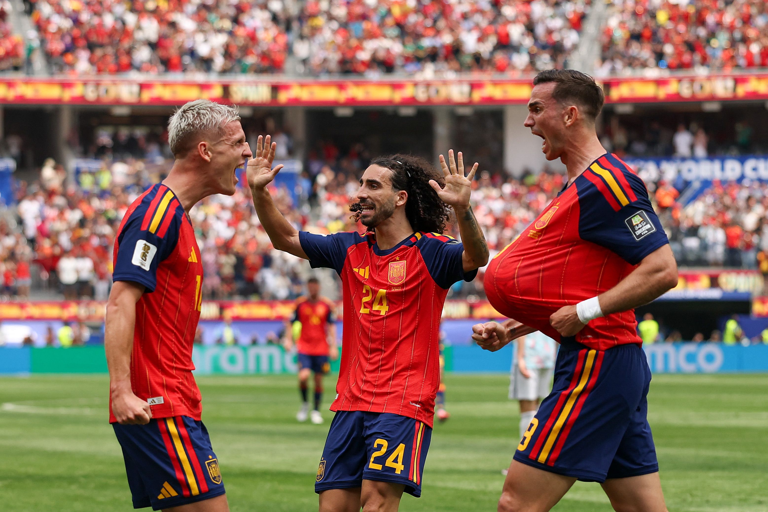INGLEWOOD, CALIFORNIA - JULY 10: Fabian Ruiz #8 of Spain celebrates with Dani Olmo #10 and Marc Cucurella #24 after scoring the team's first goal during the FIFA World Cup 2026 Quarter Final match between Spain and Belgium at Los Angeles Stadium on July 10, 2026 in Inglewood, California. Luke Hales/Getty Images/AFP (Photo by Luke Hales / GETTY IMAGES NORTH AMERICA / Getty Images via AFP)