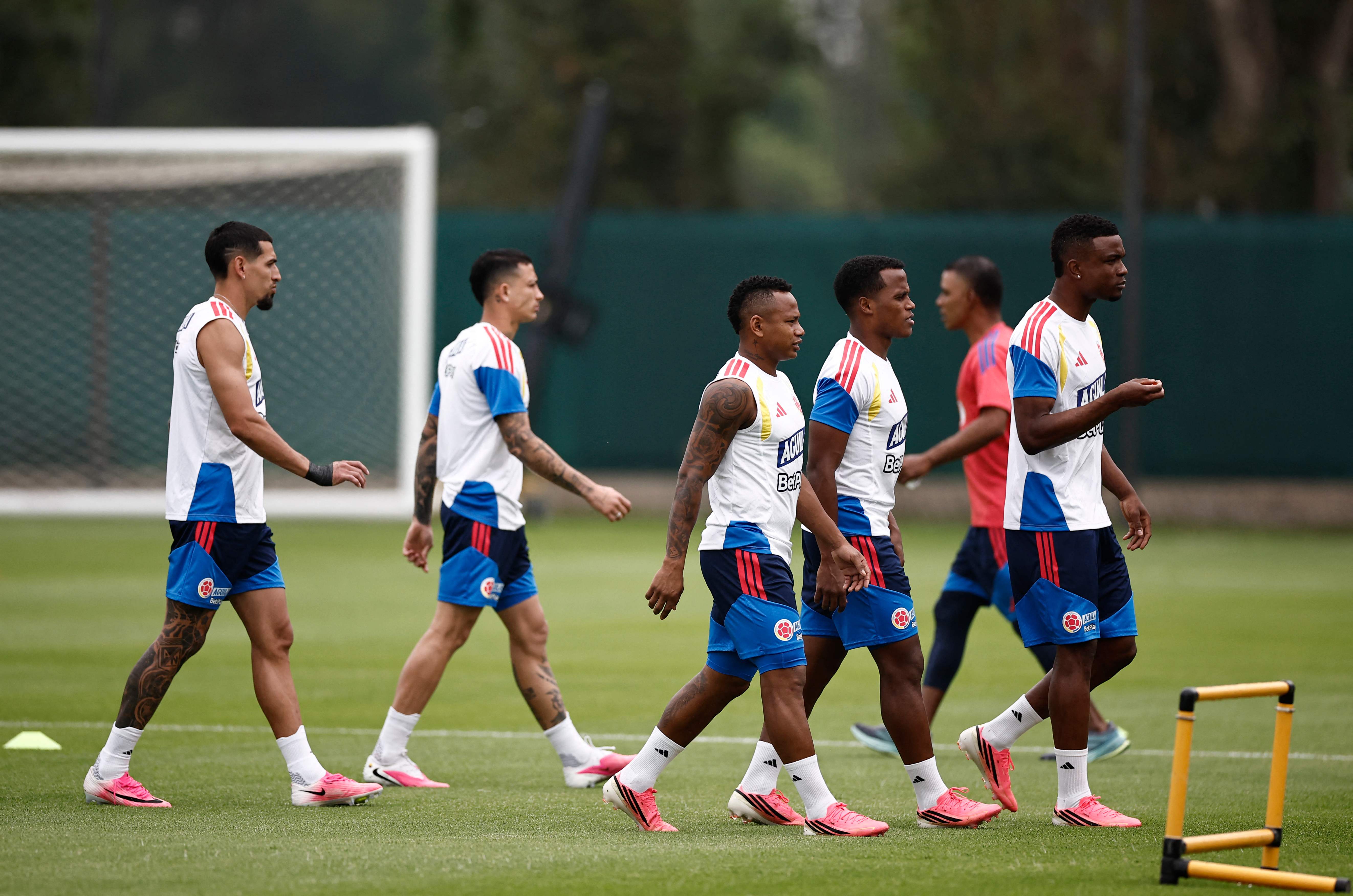 (L-R) Colombia's defender #02 Daniel Munoz, midfielder #14 Gustavo Puerta, midfielder #21 Jaminton Campaz, midfielder #11 Jhon Arias and forward #09 Jhon Cordoba walk on the pitch during a training session for the FIFA 2026 World Cup at the Academia Atlas FC in Guadalajara, Mexico on June 11, 2026. (Photo by Ulises RUIZ / AFP)