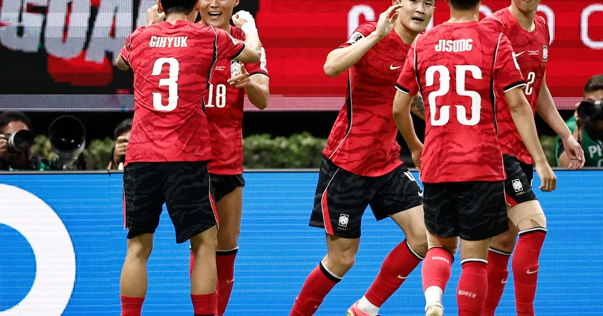 South Korea's forward #18 Oh Hyeon-gyu celebrates with teammate defender #03 Lee Gi-hyuk scoring his team's second goal during the 2026 World Cup Group A football match between South Korea and the Czech Republic at the Guadalajara Stadium in Zapopan on June 11, 2026. (Photo by Ulises RUIZ / AFP)