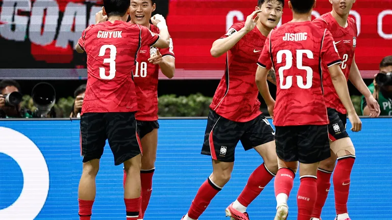 South Korea's forward #18 Oh Hyeon-gyu celebrates with teammate defender #03 Lee Gi-hyuk scoring his team's second goal during the 2026 World Cup Group A football match between South Korea and the Czech Republic at the Guadalajara Stadium in Zapopan on June 11, 2026. (Photo by Ulises RUIZ / AFP)