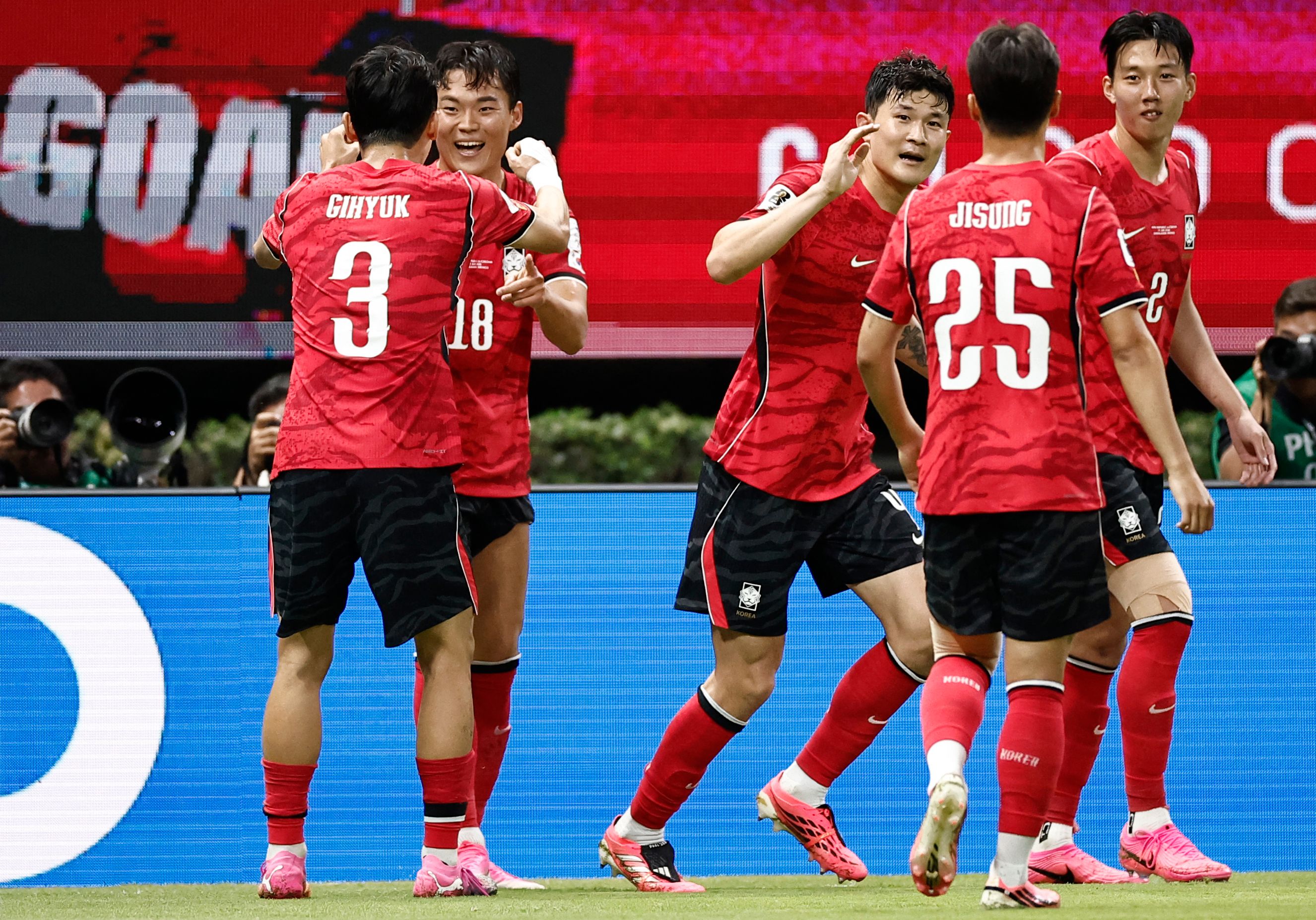 South Korea's forward #18 Oh Hyeon-gyu celebrates with teammate defender #03 Lee Gi-hyuk scoring his team's second goal during the 2026 World Cup Group A football match between South Korea and the Czech Republic at the Guadalajara Stadium in Zapopan on June 11, 2026. (Photo by Ulises RUIZ / AFP)