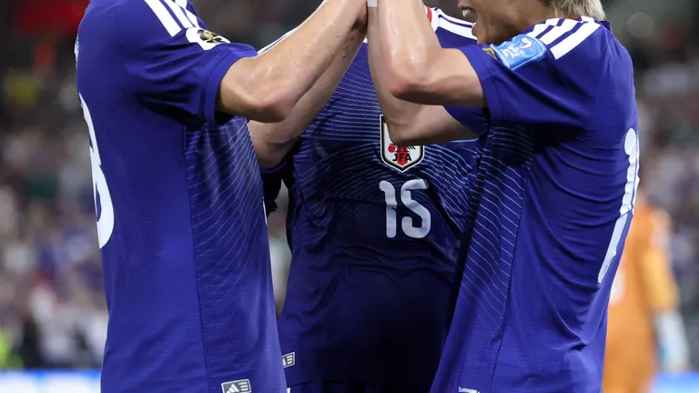 Japan's midfielder #14 Junya Ito (R) celebrates with Japan's forward #18 Ayase Ueda and Japan's midfielder #15 Daichi Kamada after scoring his team third goal during the 2026 World Cup Group F football match between Tunisia and Japan at the Monterrey Stadium in Guadalupe, Mexico, on June 20, 2026.  (Photo by Julio Cesar AGUILAR / AFP)
