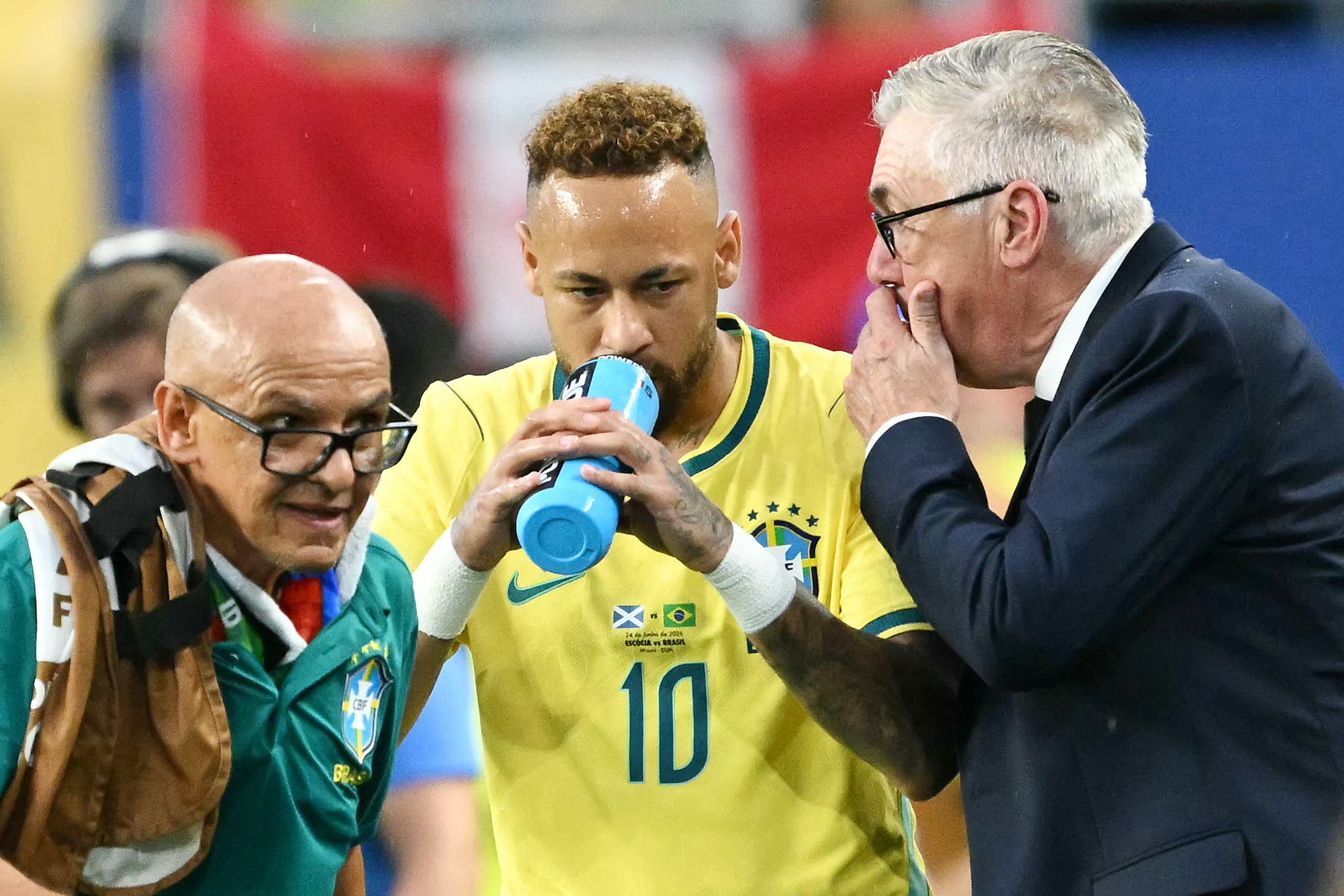Brazil's Italian head coach Carlo Ancelotti talks to his forward #10 Neymar during the 2026 World Cup Group C football match between Scotland and Brazil at the Miami Stadium in Miami Gardens on June 24, 2026.  (Photo by CHANDAN KHANNA / AFP)