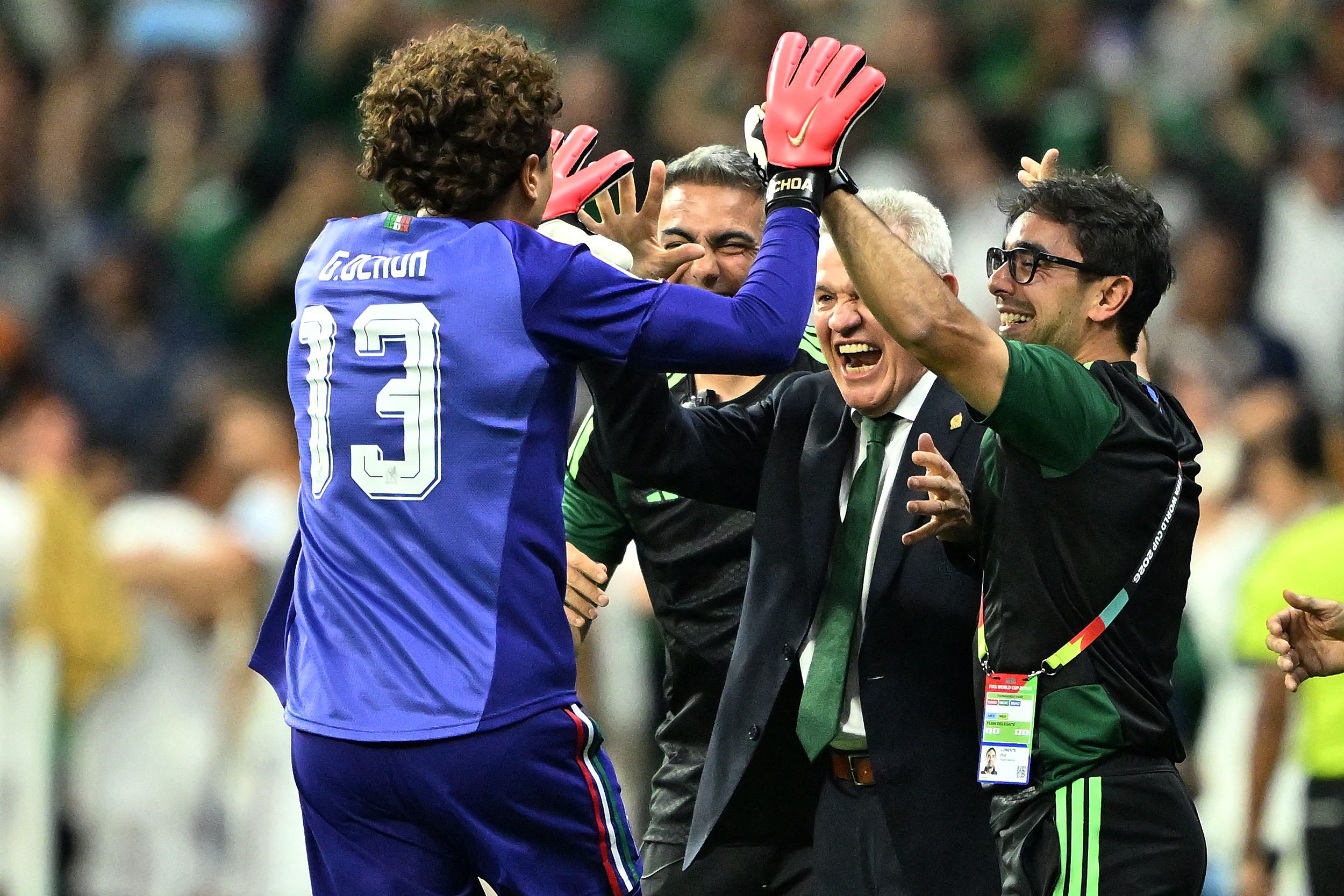 Mexico's goalkeeper #13 Guillermo Ochoa celebrates with head coach Javier Aguirre during the 2026 World Cup Group A football match between the Czech Republic and Mexico at the Mexico City Stadium in Mexico City on June 24, 2026.  (Photo by CARL DE SOUZA / AFP)