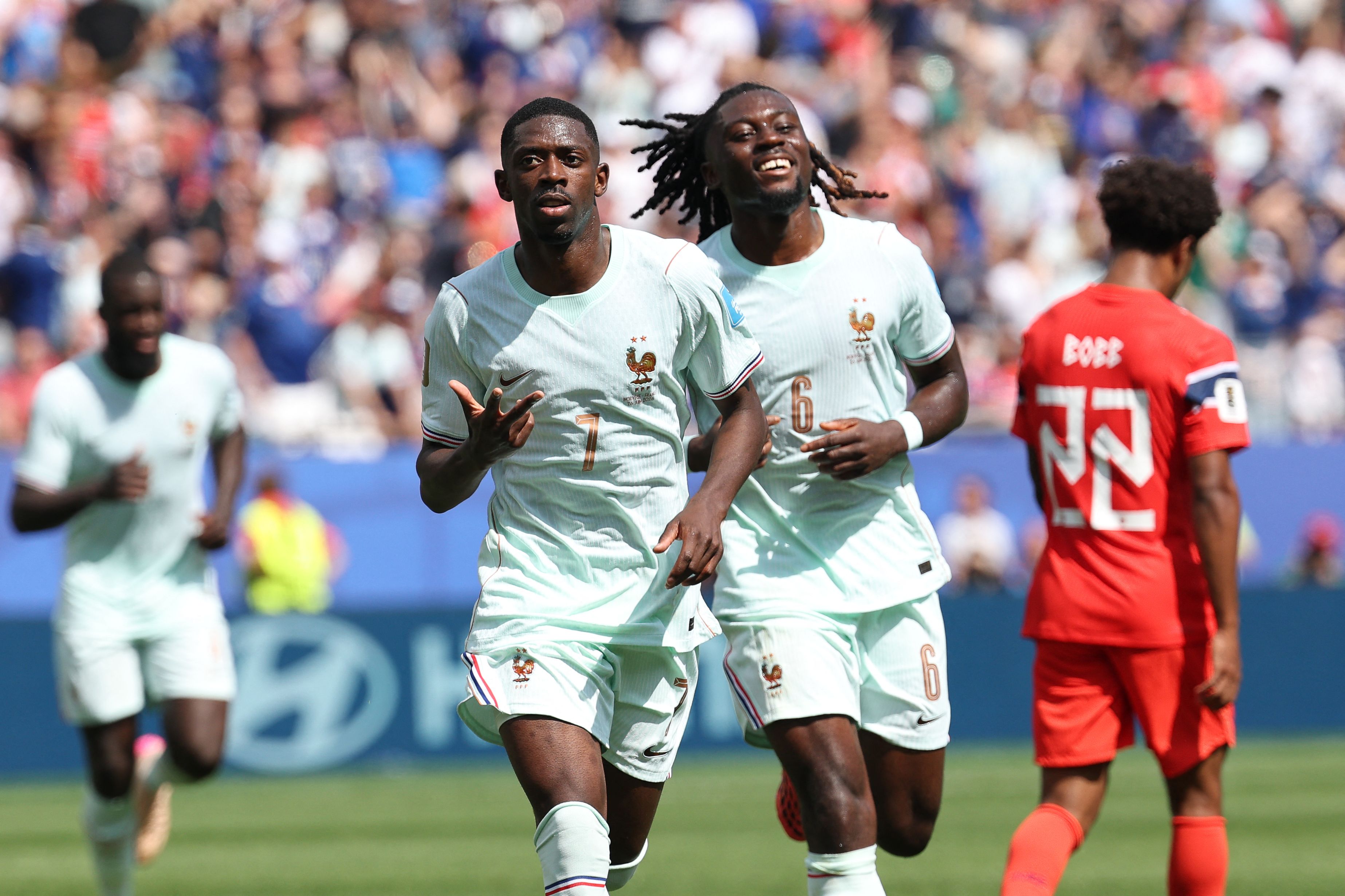 TOPSHOT - France's forward #07 Ousmane Dembele celebrates scoring his team's third goal with midfielder #06 Manu Kone during the 2026 World Cup Group I football match between Norway and France at the Boston Stadium in Foxborough on June 26, 2026. (Photo by FRANCK FIFE / AFP)