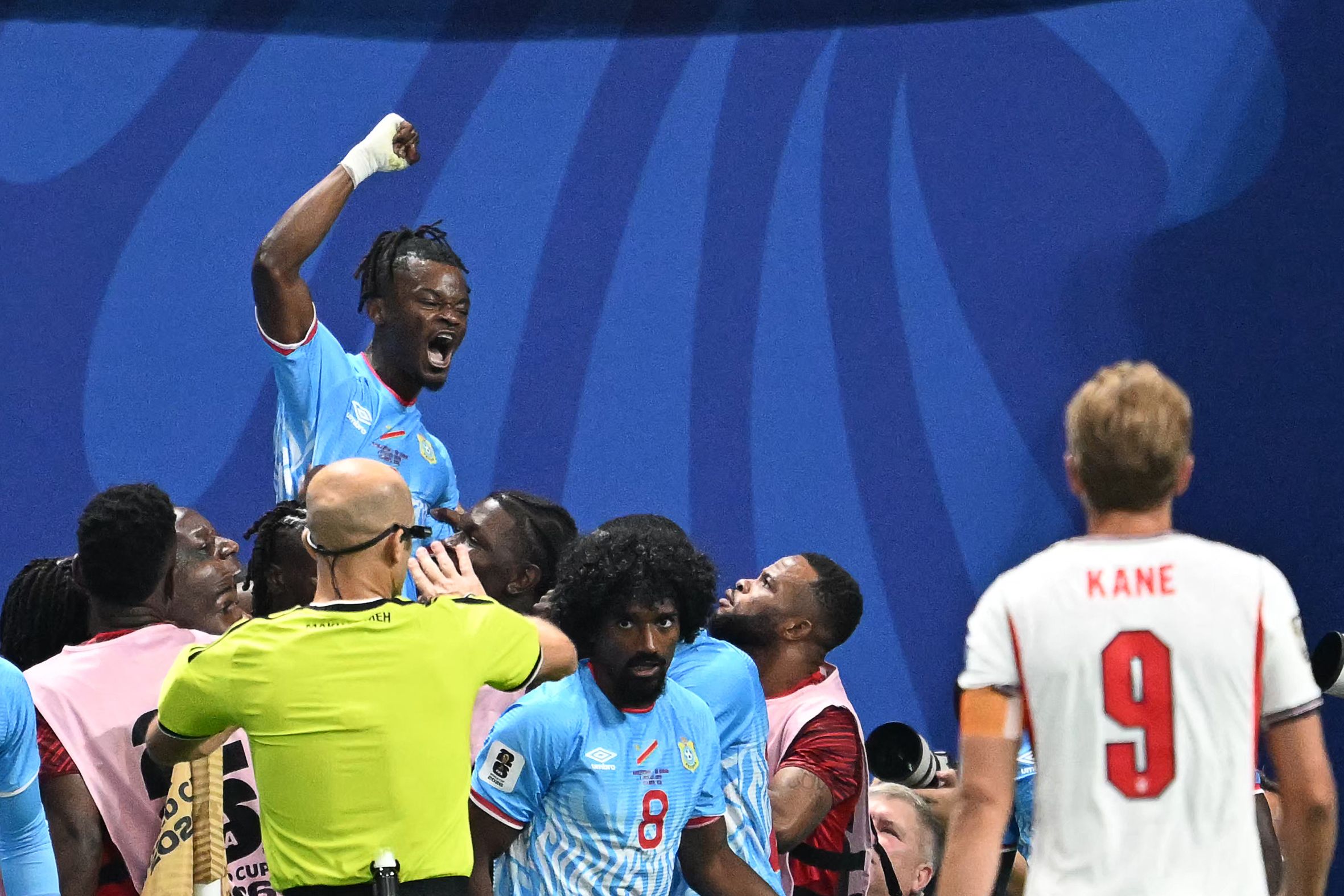 Congo DR's forward #09 Brian Cipenga celebrates with teammates scoring his team's first goal during the 2026 World Cup round of 32 match football between England and the Democratic Republic of Congo at the Atlanta Stadium in Atlanta on July 1, 2026. (Photo by ROBERTO SCHMIDT / AFP)