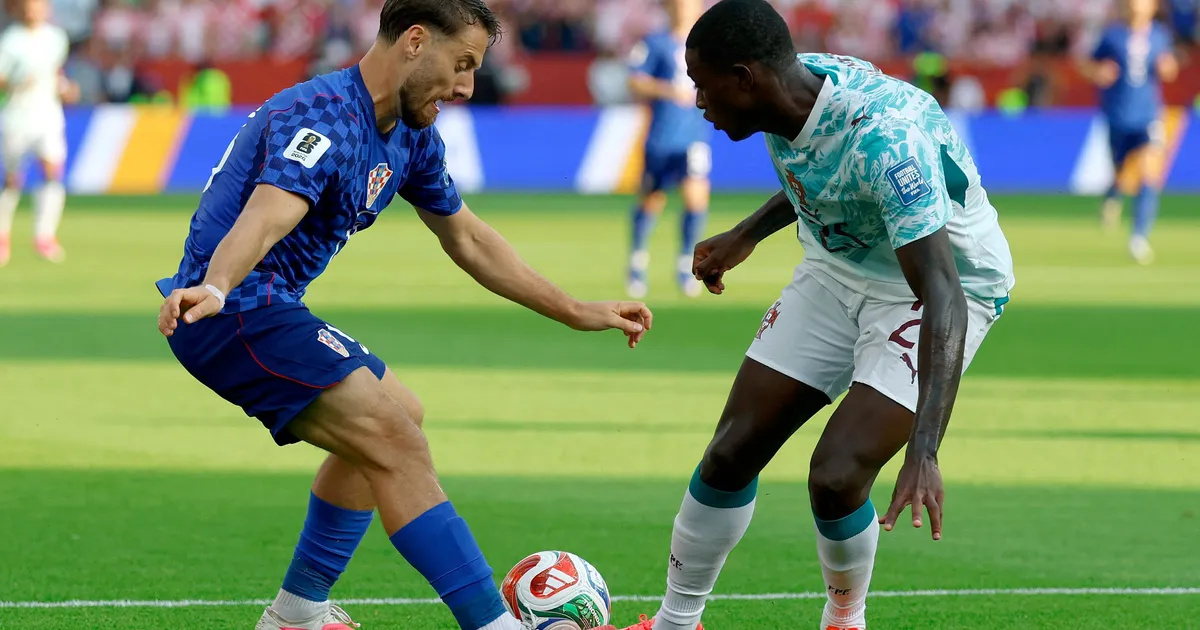 Portugal's defender #25 Nuno Mendes and Croatia's midfielder #13 Nikola Vlasic fight for the ball during the 2026 World Cup round of 32 football match between Portugal and Croatia at the Toronto Stadium in Toronto on July 2, 2026. (Photo by Kamil Krzaczynski / AFP)