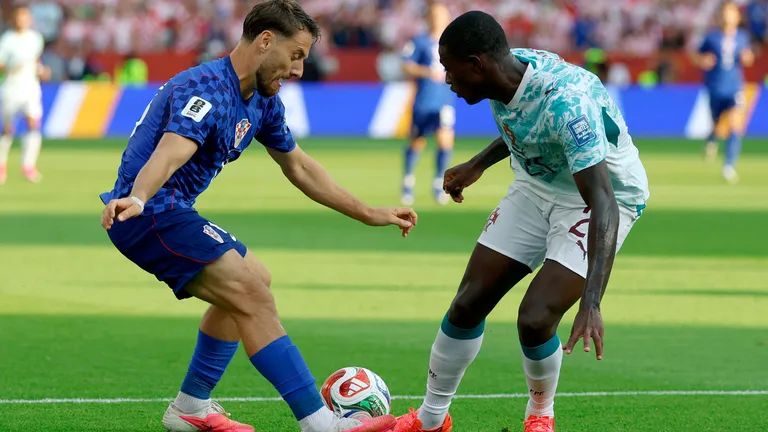Portugal's defender #25 Nuno Mendes and Croatia's midfielder #13 Nikola Vlasic fight for the ball during the 2026 World Cup round of 32 football match between Portugal and Croatia at the Toronto Stadium in Toronto on July 2, 2026. (Photo by Kamil Krzaczynski / AFP)