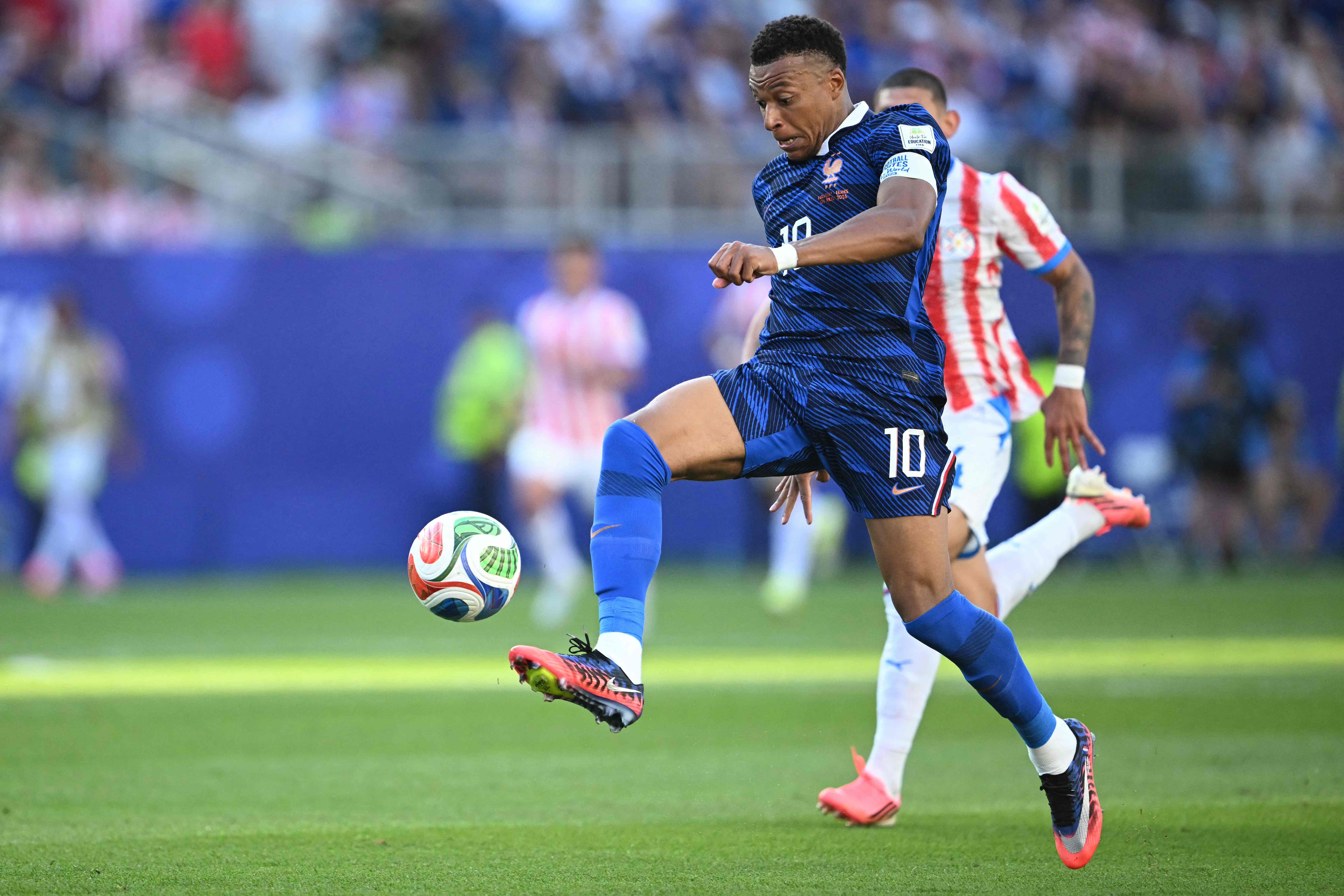 France's forward #10 Kylian Mbappe runs with the ball during the 2026 World Cup round of 16 football match between Paraguay and France at the Philadelphia Stadium in Philadelphia on July 4, 2026.  (Photo by MAURO PIMENTEL / AFP)