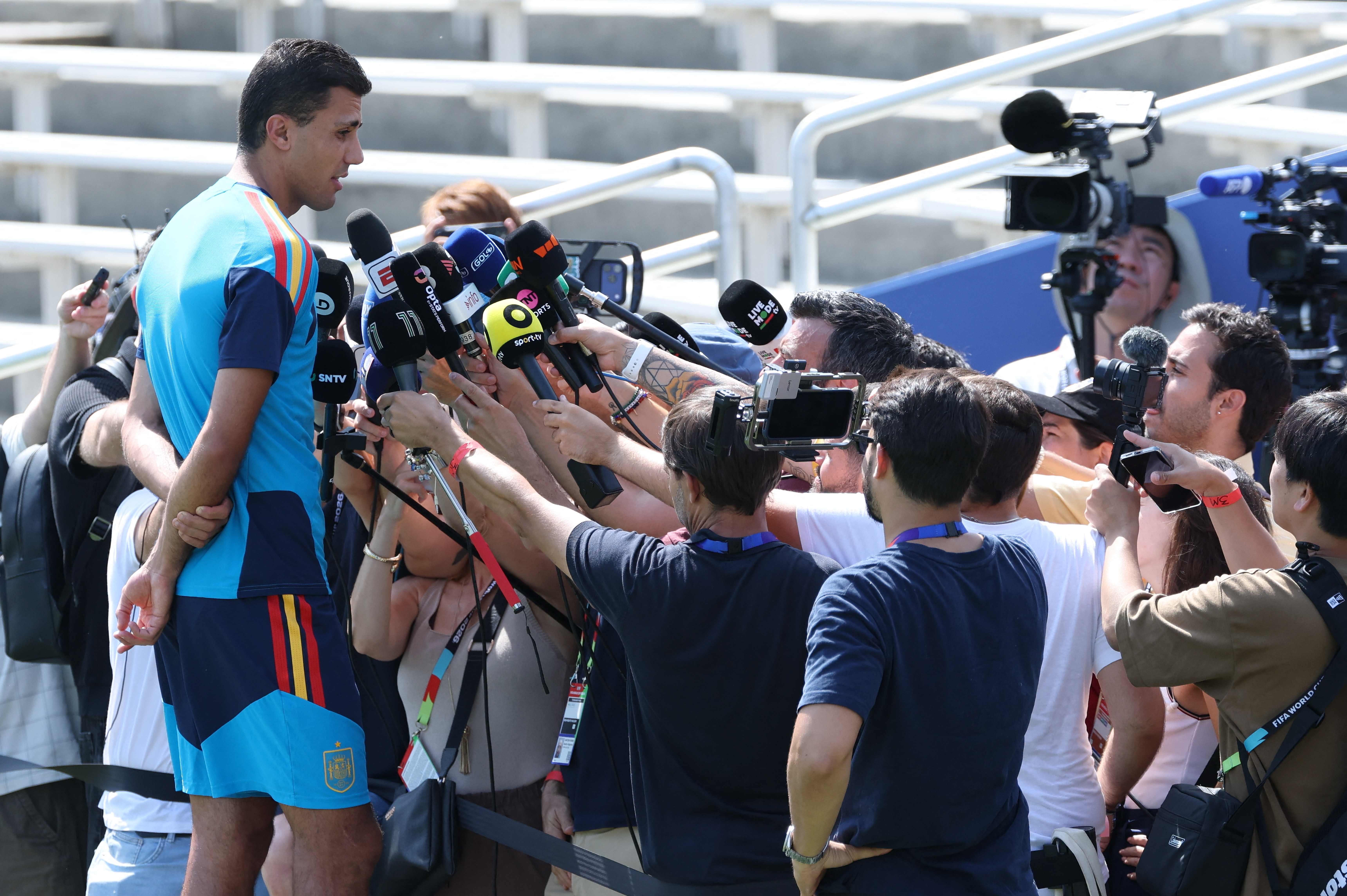 Spain's midfielder #16 Rodri speaks to media before an MD-1 training session at the Cotton Bowl in Dallas on July 5, 2026, on the eve of the 2026 World Cup round of 16 football match between Portugal and Spain. (Photo by Thomas COEX / AFP)