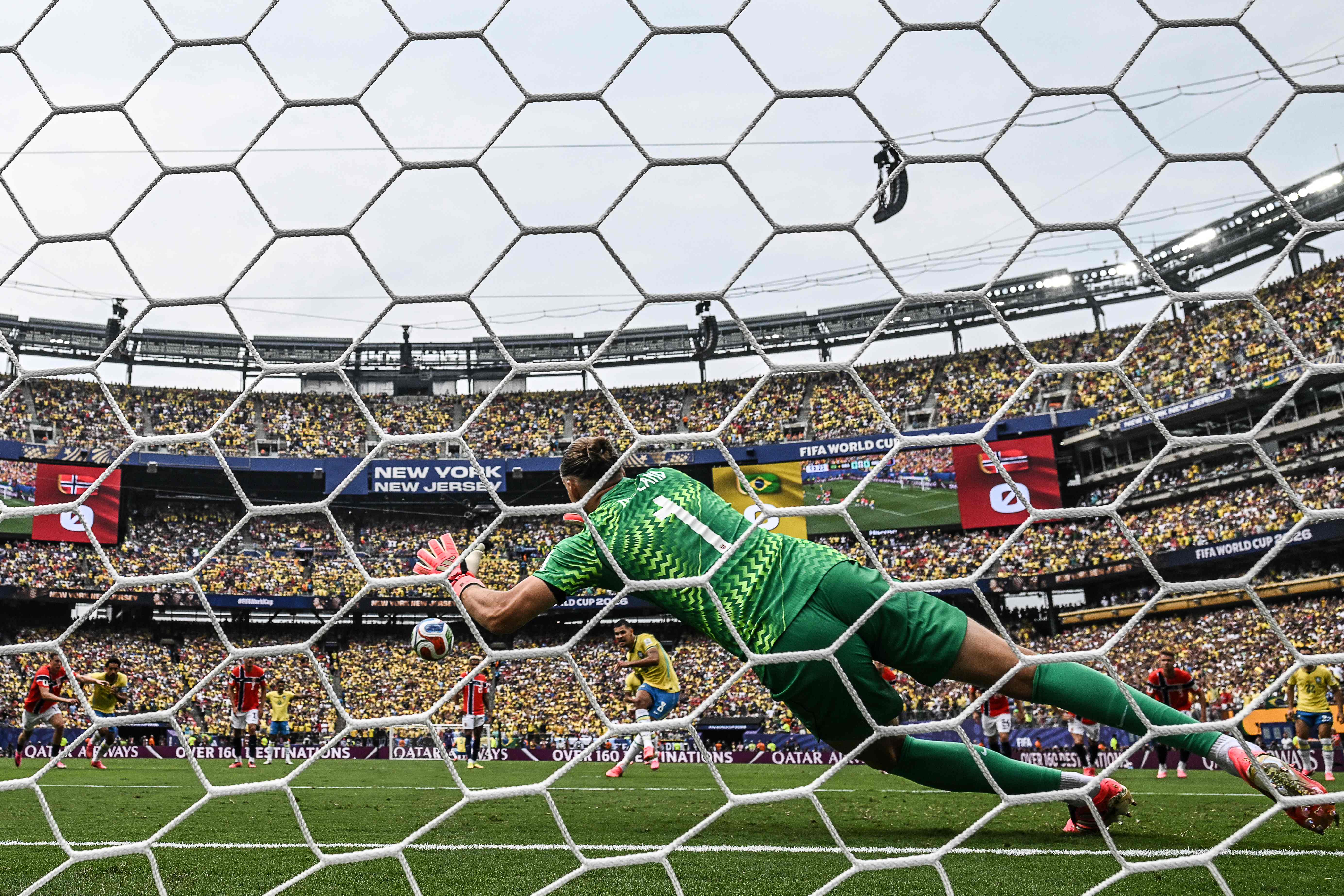 TOPSHOT - Norway's goalkeeper #01 Orjan Nyland stops the penalty kick by Brazil's midfielder #08 Bruno Guimaraes (c) during the 2026 World Cup round of 16 football match between Brazil and Norway at the New York/New Jersey Stadium in East Rutherford on July 5, 2026. (Photo by MAURO PIMENTEL / AFP)