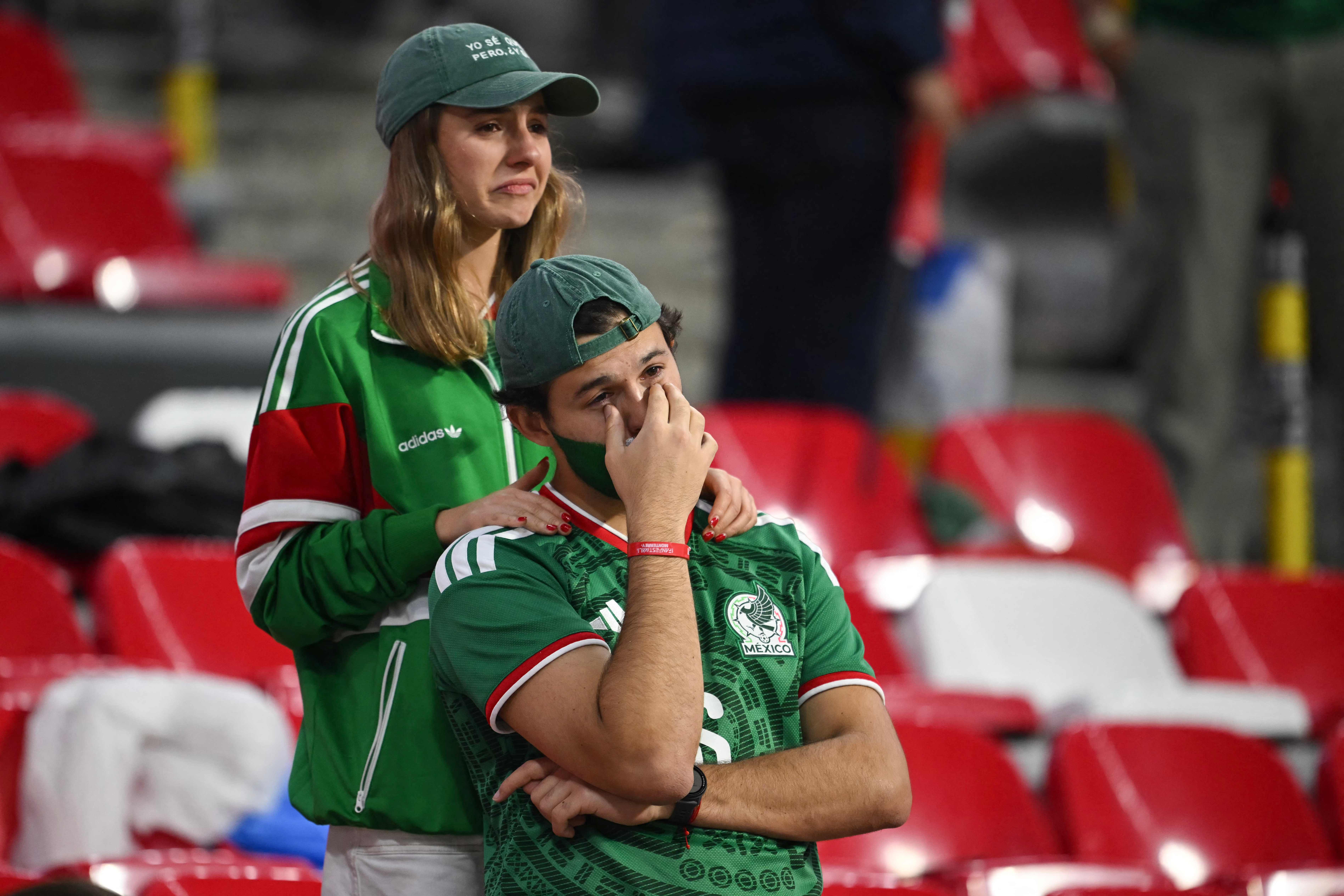 Mexican fans react after losing the 2026 World Cup round of 16 football match between Mexico and England at the Mexico City Stadium in Mexico City on July 5, 2026.  (Photo by CARL DE SOUZA / AFP)