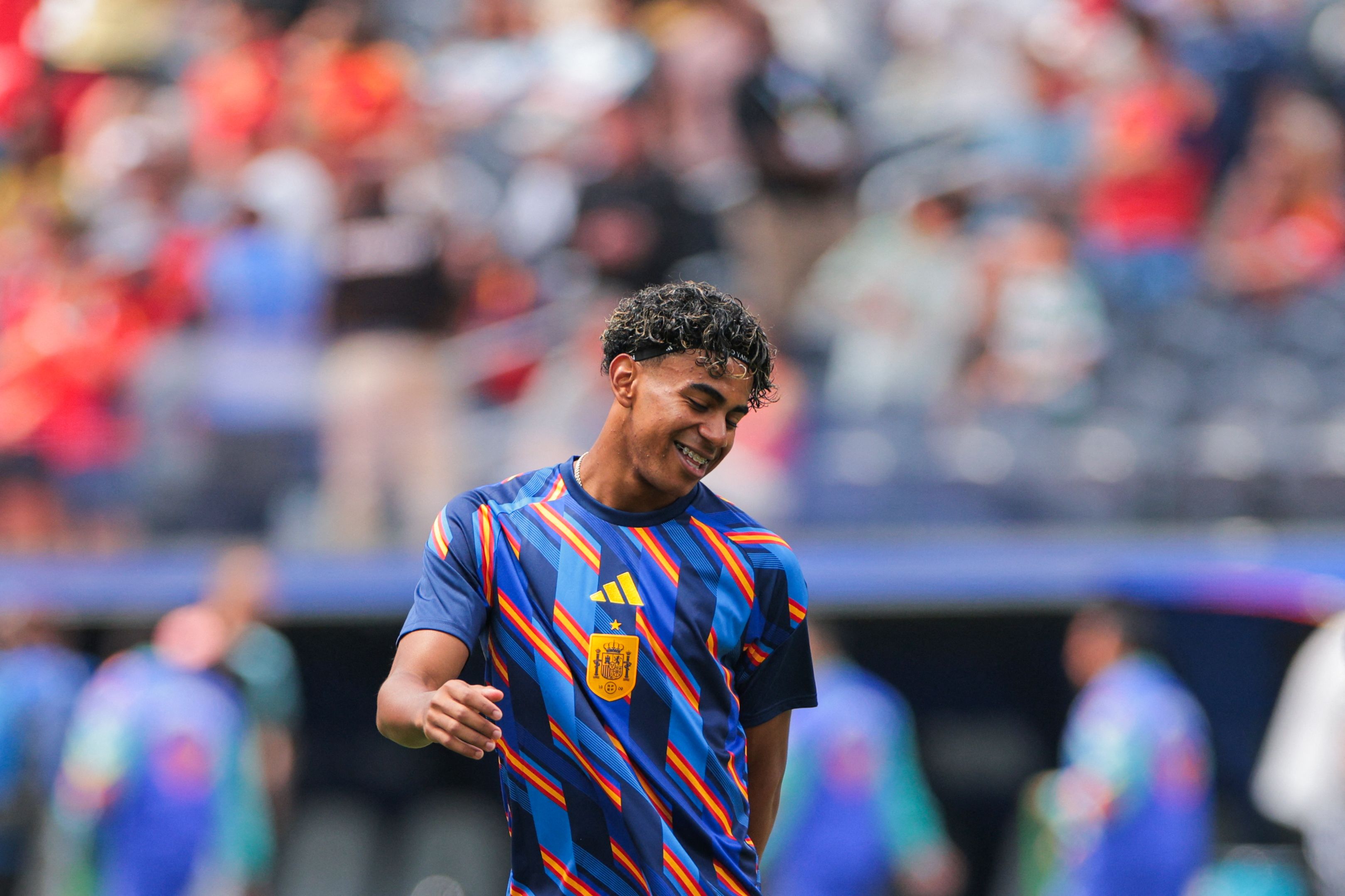 Spain's forward #19 Lamine Yamal smiles as he warms up ahead of the 2026 World Cup football tournament quarter-final match between Spain and Belgium at the Los Angeles Stadium in Inglewood on July 10, 2026. (Photo by Etienne LAURENT / AFP)