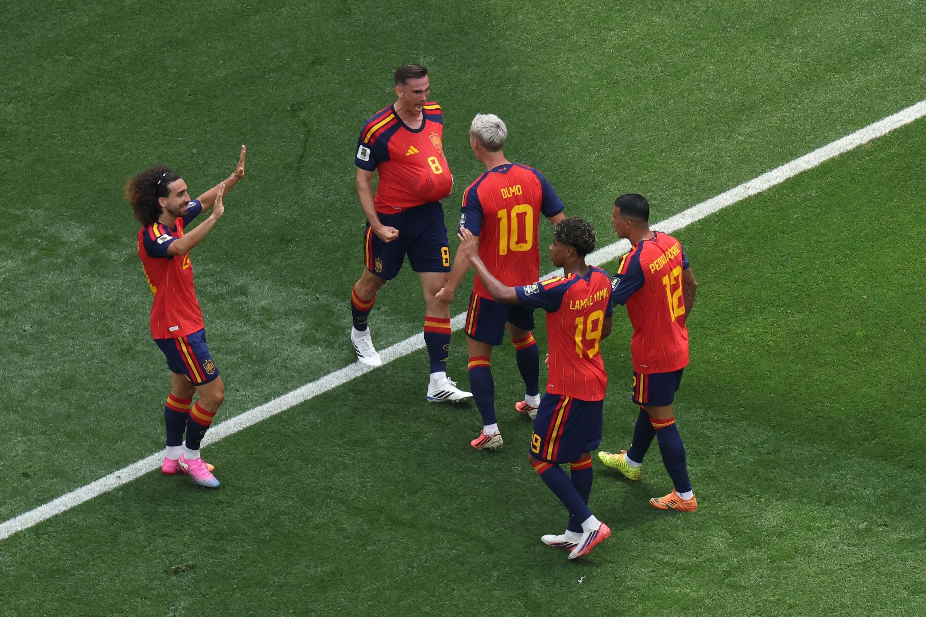 TOPSHOT - Spain's midfielder #08 Fabian Ruiz celebrates scoring his team's first goal with teammates during the 2026 World Cup football tournament quarter-final match between Spain and Belgium at the Los Angeles Stadium in Inglewood on July 10, 2026. (Photo by VALERIE MACON / AFP)