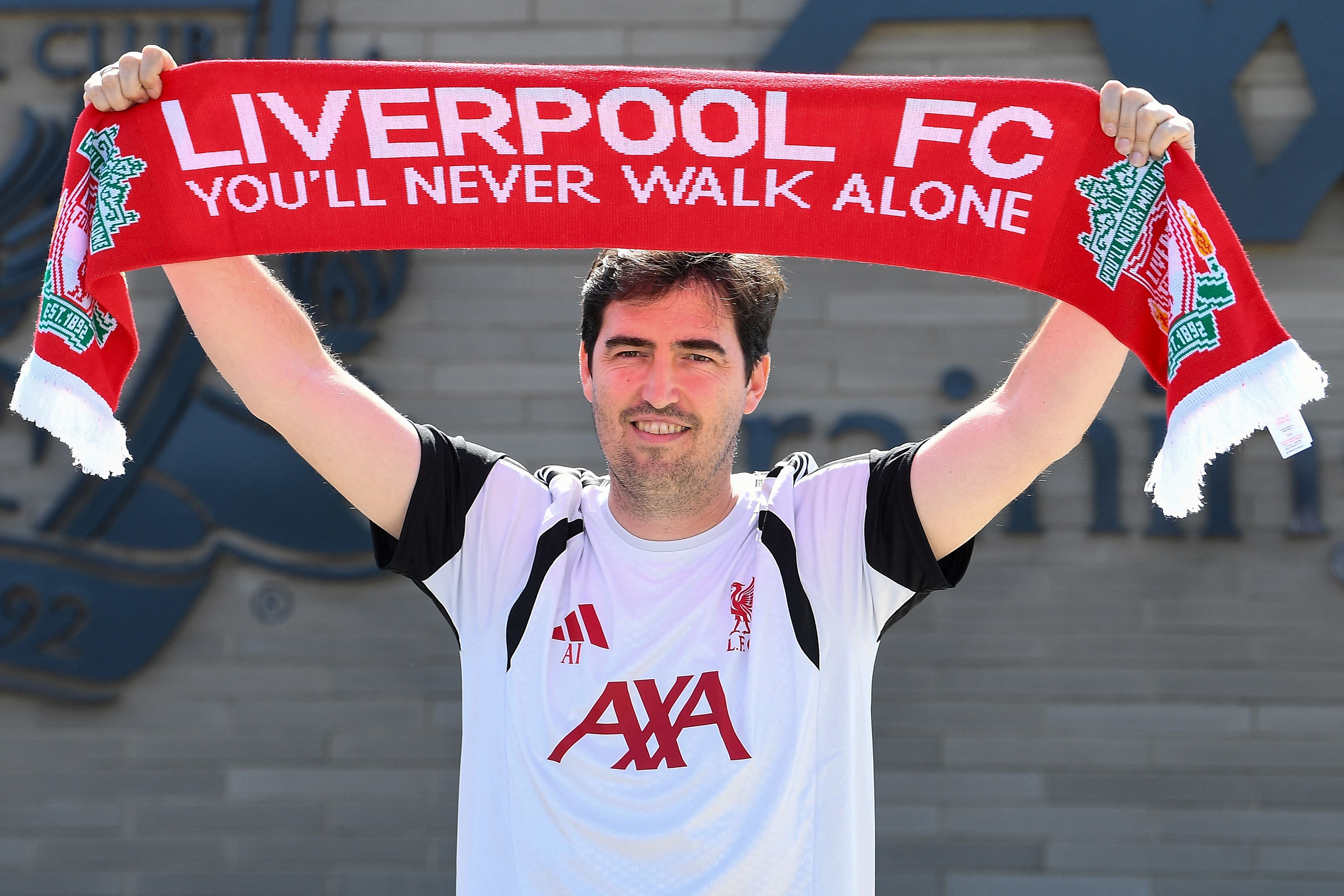 TOPSHOT - Andoni Iraola, the new manager for English Premier League football side Liverpool, poses as he meets the media at the team's training ground in Kirkby, Liverpool, north-west England on July 13, 2026. (Photo by PETER POWELL / AFP)