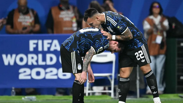 TOPSHOT - Argentina's forward #22 Lautaro Martinez celebrates scoring his team's second goal with Argentina's forward #10 Lionel Messi during the 2026 World Cup football tournament semi-final match between England and Argentina at the Atlanta Stadium in Atlanta on July 15, 2026.  (Photo by ROBERTO SCHMIDT / AFP)