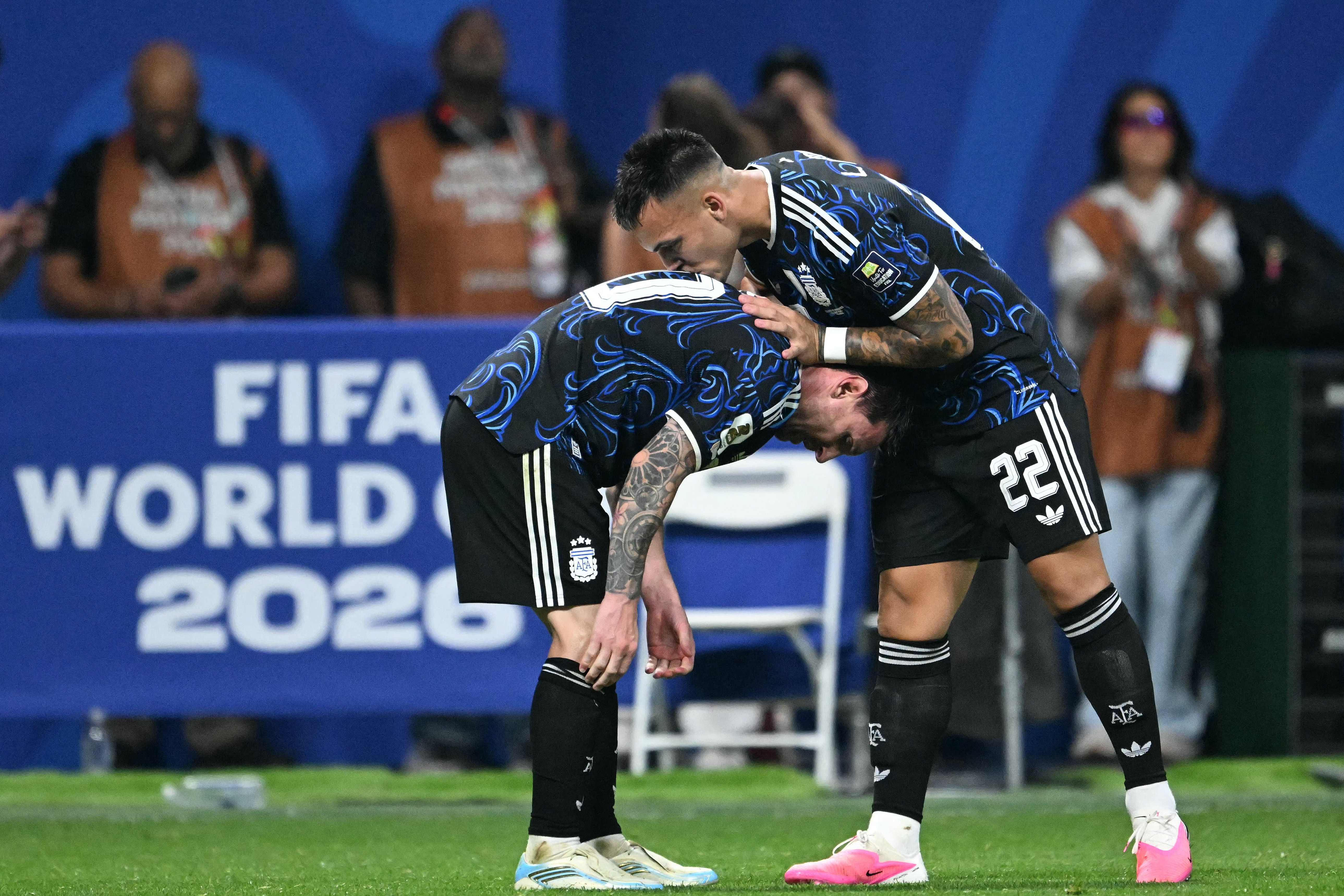 TOPSHOT - Argentina's forward #22 Lautaro Martinez celebrates scoring his team's second goal with Argentina's forward #10 Lionel Messi during the 2026 World Cup football tournament semi-final match between England and Argentina at the Atlanta Stadium in Atlanta on July 15, 2026. (Photo by ROBERTO SCHMIDT / AFP)