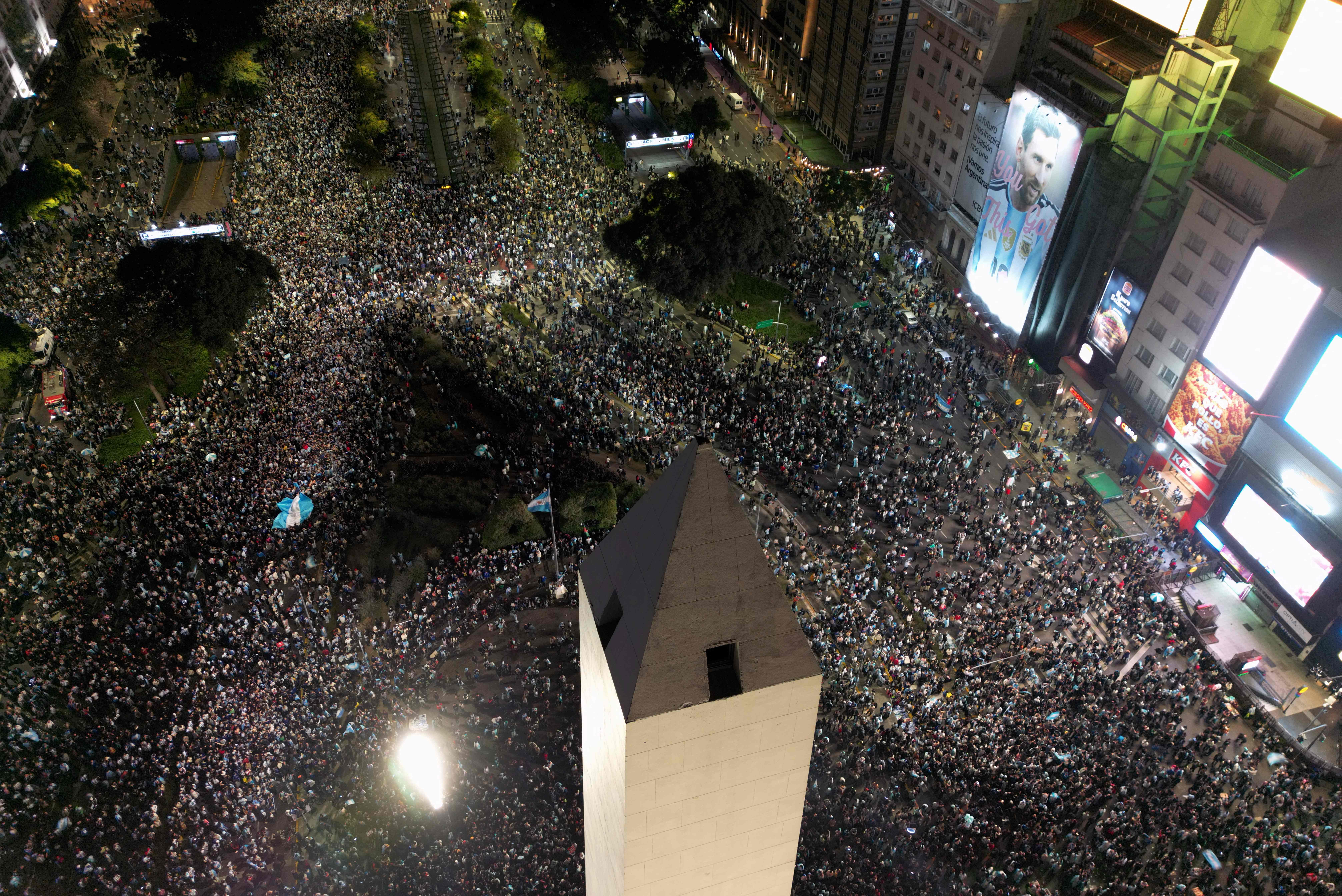 In this aerial view fans celebrate Argentina's victory over England in the 2026 FIFA World Cup semi-final football match at the Obelisk in Buenos Aires on July 15, 2026. (Photo by Luis ROBAYO / AFP)
