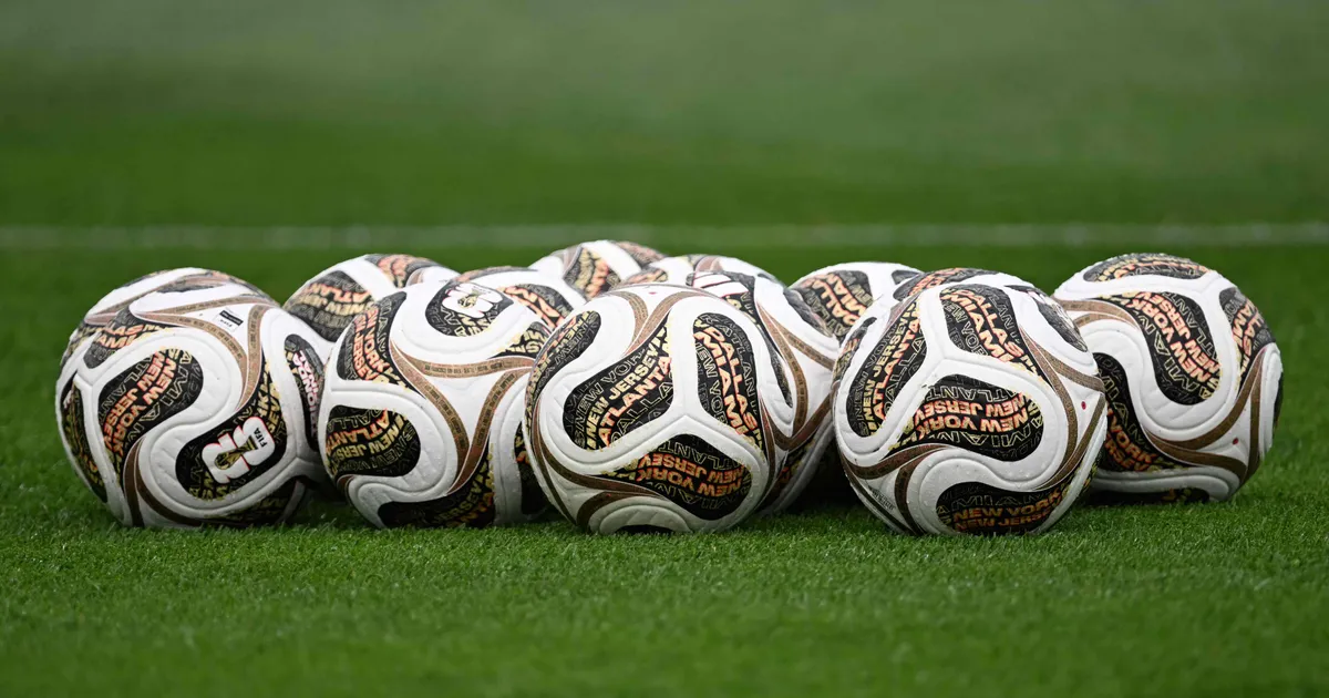 A photo shows official competition balls for the final stages on the pitch during a Spain training session at Melanie Lane Training Grounds in East Hanover, New Jersey, on July 16, 2026, ahead of the 2026 World Cup football tournament final match between Spain and Argentina. (Photo by MAURO PIMENTEL / AFP)