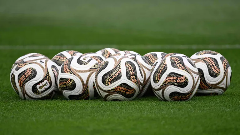 A photo shows official competition balls for the final stages on the pitch during a Spain training session at Melanie Lane Training Grounds in East Hanover, New Jersey, on July 16, 2026, ahead of the 2026 World Cup football tournament final match between Spain and Argentina. (Photo by MAURO PIMENTEL / AFP)