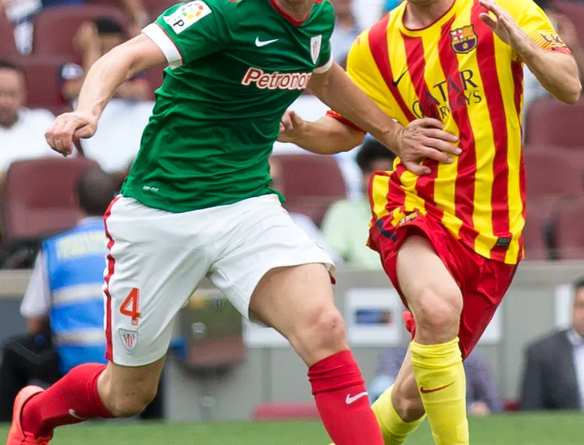 Aymeric Laporte and Leo Messi during La Liga clash between FC Barcelona and Athletic Bilbao in September 2014.