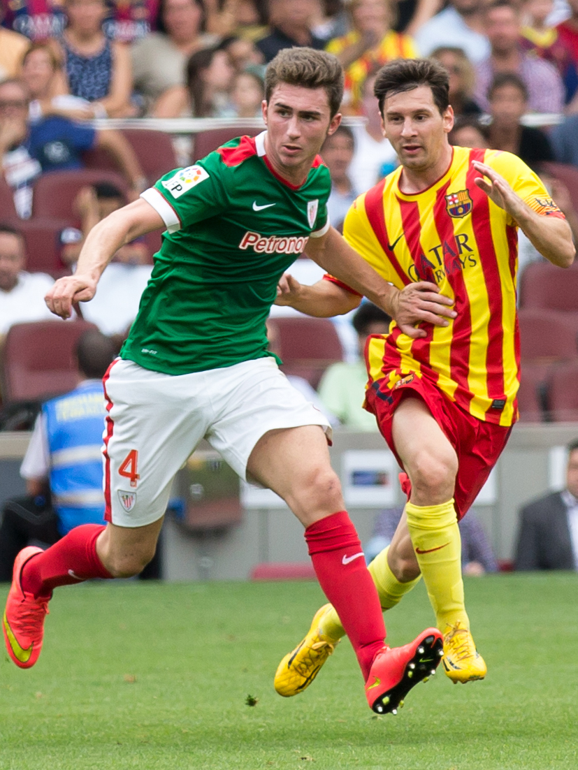 Aymeric Laporte and Leo Messi during La Liga clash between FC Barcelona and Athletic Bilbao in September 2014.