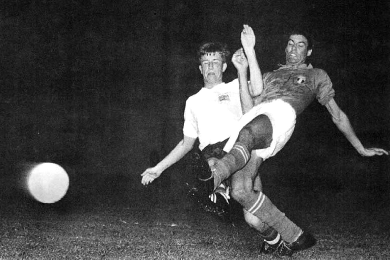 Italy's Sandro Salvadore tackles the Brit Bobby Brown during Italy - Great Britain 2-2 at the association football olympic tournament in Rome, 1960