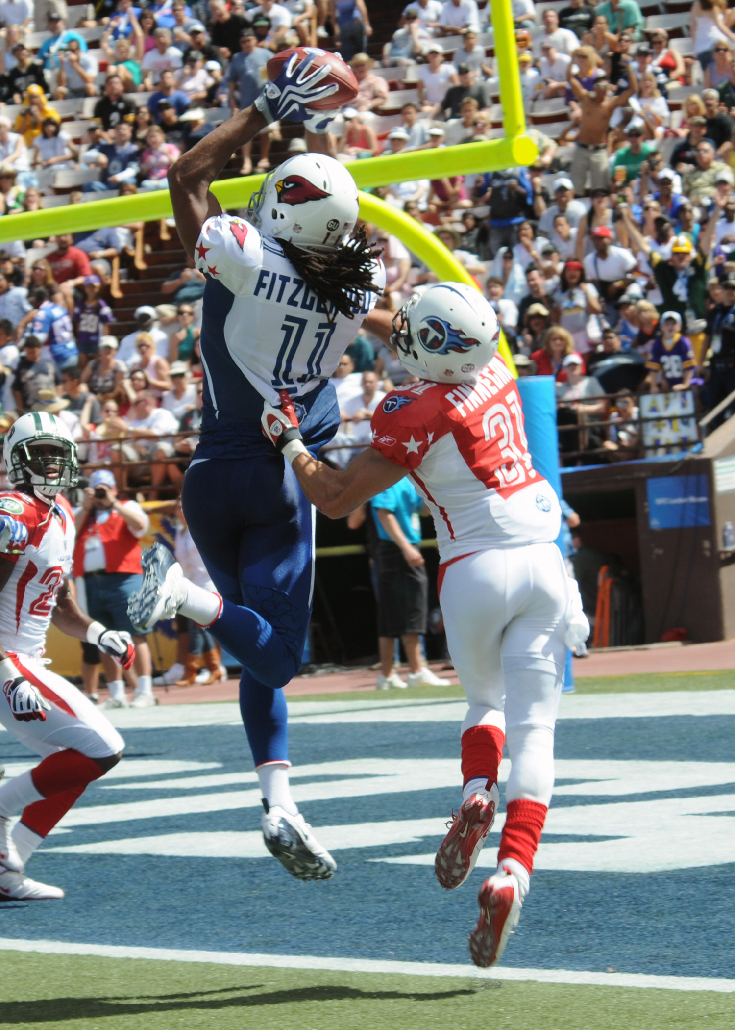 Arizona Cardinals wide receiver Larry Fitzgerald catches a touchdown pass from New Orleans Saints quarterback Drew Brees during the fourth quarter of the National Football League Pro Bowl Feb. 8, 2009, at Aloha Stadium in Honolulu. VIRIN: 090208-N-9758L-854